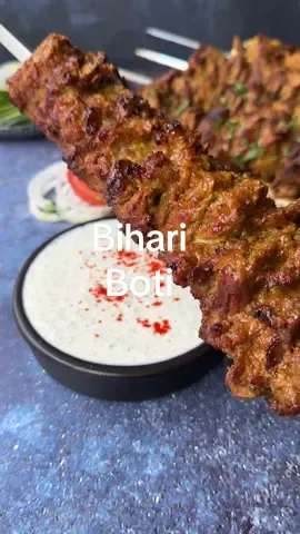 Bihari Boti Kebab ( Eid ul Adha Special)  Here is the detailed recipe for Bihari Boti Kebab: Ingredients: - 2 kg boneless beef/lamb/mutton - 1/2 cup yogurt - 1 tbsp ginger paste - 1 tbsp garlic paste - 1 tbsp green chili paste - 1/2 cup papaya paste - Salt to taste - 1 tsp cumin powder - 1 tsp coriander powder - 1 tsp red chili powder - 1/2 tsp citric acid - 1 tsp garam masala - 1/2 tsp ground black pepper - 1/4 tsp ground nutmeg - 1/4 tsp ground mace - 1/2 tsp turmeric - 2 tbsp lemon juice - 2 tbsp mustard oil - 2 onions, thinly sliced and fried until golden brown, then dried and powdered - Skewers for grilling Instructions: 1. Cut the boneless meat into thin, small bite-sized pieces. 2. In a large mixing bowl, combine yogurt, papaya paste, ginger paste, garlic paste, and green chili paste. Mix well. 3. Add salt, cumin powder, coriander powder, red chili powder, citric acid, garam masala, ground black pepper, ground nutmeg, ground mace, turmeric, lemon juice, and mustard oil to the marinade mixture. Mix everything well. 4. Add the fried and powdered onions to the marinade mixture and mix until well combined. 5. Add the cut meat to the marinade and mix well to ensure the meat is well coated. Cover the bowl and let it marinate in the refrigerator overnight for the flavors to develop. 6. Thread the marinated meat onto skewers. 7. Preheat the grill and brush with oil to prevent sticking. 8. Grill the skewers of marinated meat on medium heat, turning occasionally, until the meat is cooked through and tender. This will take about 18-20 minutes depending on the thickness of the meat. 9. Once cooked, remove the skewers from the grill and serve the Bihari Boti Kebabs hot with mint chutney and naan. Enjoy your flavorful and tender Bihari Boti Kebabs!
