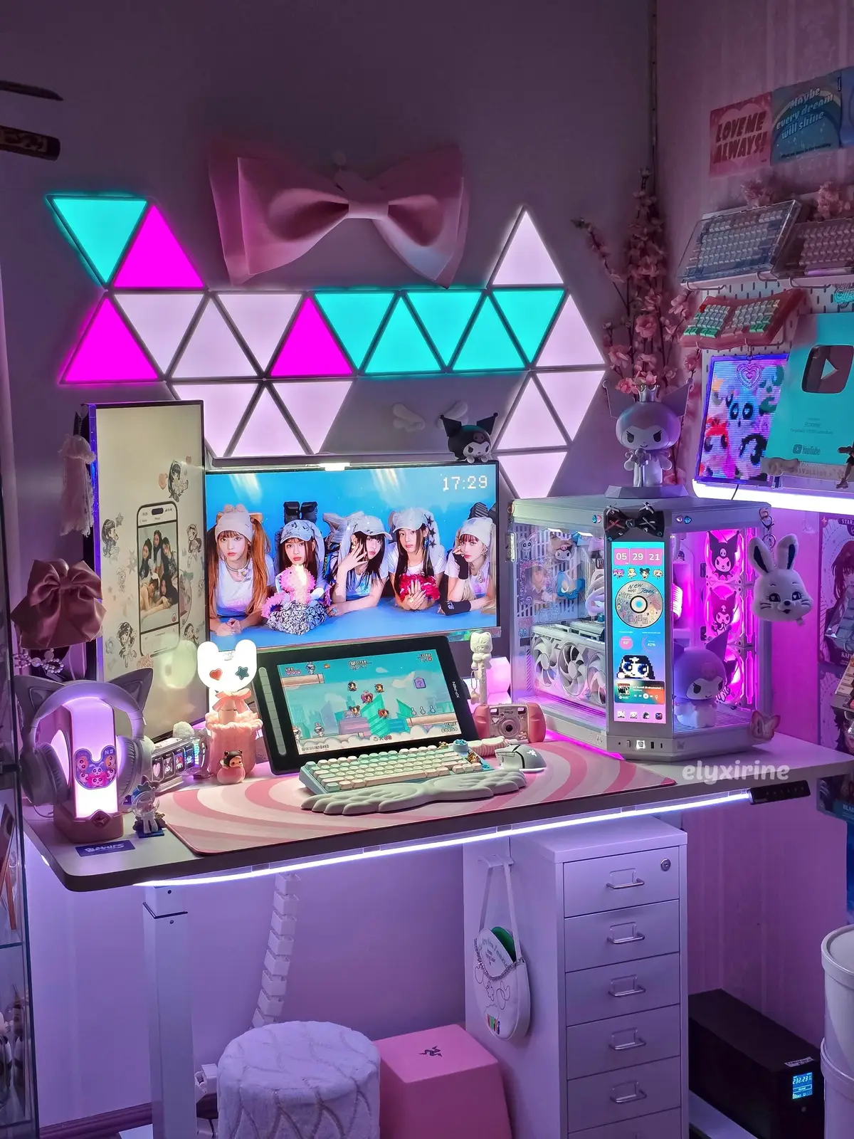 I'm still diggin' my 57th monthly themed setup from May, NewJeans themed battlestation 🐰 but now with a few changes! my gaming area feels so much cozier and looks brighter than before 🥹 what do youu think?  new setup upgrades:  • XP-PEN Artist 16 pen display gfted by @Le Petit Prince and @XPPen Official  • Govee triangle light panels (bday treat for myself hehe) @govee • installed a white wallpaper in my PC area only happy saturdayy gamers! stay hydrated ✨ #newjeans #pcsetup #pcbuild #hyte #hanni 