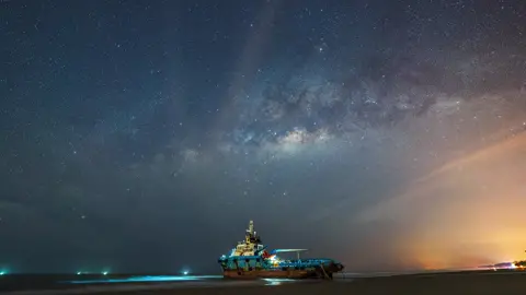 Milky Way rising above a stranded vessel in Kuantan, Pahang captured with Sony Alpha 7R IV + 14mm f1.8 G Master lens by @Fakrul Jamil 🛥️🌌  #milkyway #sonyalpha #timelapse