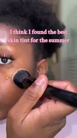 This skin tint is literally that…SKIN. I think I found the best skin tint for the summer that wont dry out my skin. Off to test it out in this summer heat ✌🏾Which brand do you think this is? #summermakeup #skintint #blackgirlmakeup #blackgirltiktok #dryskin #skincareroutine #colormatch #creatorsearchinsights 