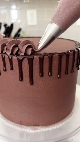 Is there anything more perfect than a chocolate cake with chocolate buttercream frosting!? What frosting would you pair with this moist and tender chocolate cake? Recipe on cakemehometonight.com! #cake #chocolatecake #cakedecorating 