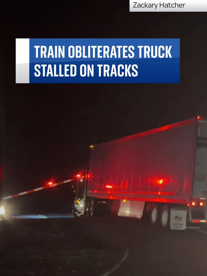 A #truck driver managed to #escapehis vehicle just moments before it was obliterated by a #trainafter getting #stuckon the tracks.