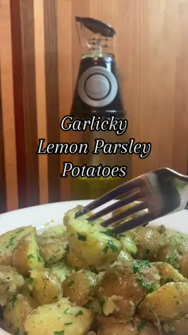 These Garlicky Lemon Parsley Potatoes are an easy side dish that are packed with flavor. I hope you enjoy!  Ingredients:  * 1 1/2 Pounds Small Potatoes  * 1/3 Cup Olive Oil * 5 Cloves Garlic - Minced * 1 tsp Kosher Salt  * 1/2 tsp Black Pepper * Zest of One Lemon * 1/2 Cup Fresh Parsley  Preparation:  1. Add potatoes to a medium sauce pan & cover with cold water.  2. Bring to a boil & lower to medium-high heat. Cook for 15 minutes or until potatoes are tender. Drain & cut in half.  3. Add oil to the pan & sauté garlic for one minute. Return the potatoes to the pan and add in the salt, pepper, lemon zest & parsley. Stir well to combine.  #potatoes #sidedish #EasyRecipe #quickrecipes  
