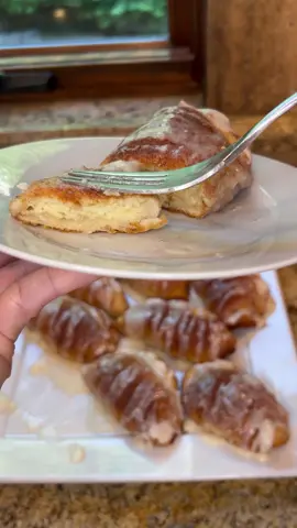 EASY CREAM CHEESE STUFFED CINNAMON & SUGAR  BISCUITS WITH GLAZE!! INGREDIENTS: * Pillsbury Grands Biscuits (Original, 8 count) * 8 ounce cream cheese - softened  * 1/4 cup sugar * 1 egg * 1 teaspoon vanilla * 1/2 teaspoon salt * About 2 1/2 to 3 tablespoons melted butter to brush on biscuits  * Cinnamon and sugar mixture (About 1/4 cup sugar and 1 TBSP cinnamon) ***GLAZE: * 2-3 tablespoons butter * 1 teaspoon vanilla  * 1 tablespoon milk (add 1 teaspoon if you want thinner) * 1 cup powdered sugar DIRECTIONS: >> Preheat oven to 350° degrees >> Cream together softened cream cheese, sugar, egg, vanilla, and salt until nice and smooth.  >> Pop open can of Pillsbury biscuits. On lightly floured surface, roll out single biscuit. Roll it nice and thin.  >> Put one large spoonful of cream cheese mixture in center of biscuit. About one heaping tablespoon.  Gently spread cream cheese to oval shape, not too close to edges. Pull over top half of circle and make a half circle. Gently press down edges. Fold and twist edge in twisting motion, pressing down final corner.  >> Place on cookie sheet or cake pan on a piece of parchment paper.  Repeat with each biscuit.   >> Brush with melted butter.  >> Sprinkle with cinnamon and sugar mixture.  >> Bake at 350° for 19 to 23 minutes or until nice and golden brown (desired doneness) >> Remove from oven and let cool for 5 or so minutes on cooling rack. >> Make glaze. Mix with a fork or whisk.   >> Place on serving platter and drizzle with glaze.  >> ENJOY!!!  Delicious for breakfast or brunch with some fruit, or any time of day!!!  Sooo tasty and easy!!!   @Pillsbury  #biscuits #cinnamon #sugar #creamcheese #creamcheesefilling #breakfast #brunch #glaze #pillsbury #delicioustreat #Foodie