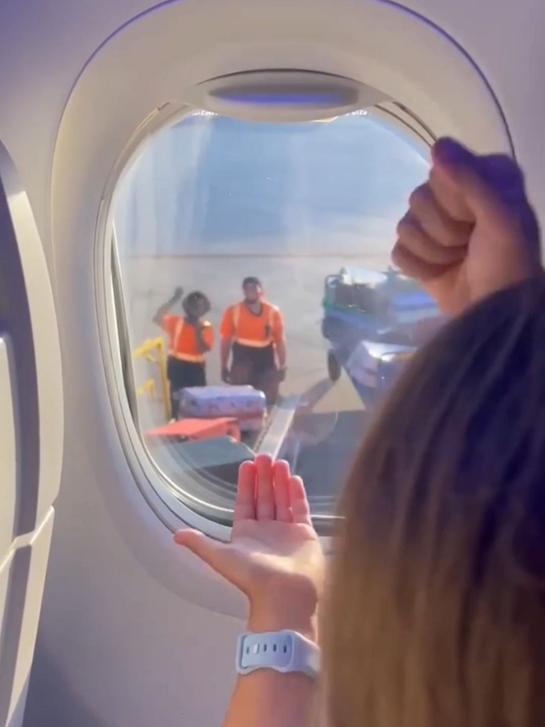 Ground crew play rock paper, scissors with departing plane passengers. Big W move from the ground crew! 🥰 #groundcrew #holiday #passengers  Discover Newsflare, home to the internets biggest #viral moments. Licence videos for use on your channels, or upload your videos today to start earning! 🔗 Visit the link in bio for more