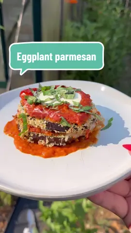 My fav way to make eggplant parm!  For the sauce:  This is a general recipe, but I honestly don’t measure exact! Just throw whatever you want into a roasting dish. If you don’t want to make your own sauce, skip and use your favorite canned/jarred tomato sauce.  10-12 paste tomatoes, halved 4 shallots, halved 6 cloves garlic 1 jalapeno (optional), halved Fresh oregano 1/2 cup olive oil Splash of dry white wine Salt to taste For the rest (makes 6): 1 large eggplant, cut into twelve 1/2 inch thick slices Kosher salt  1 cup seasoned panko (you can use Italian breadcrumbs as well, I just find that panko makes it a bit lighter and lets the eggplant shine a little more) 1 cup all purpose flour 2-3 eggs, beaten  Fresh basil  1/2 cup parmesan grated 1 cup shredded mozzarella (or more if not using slices) 6 slices mozerella (optional) Roast your tomatoes, shallots, garlic, jalapeño, and olive oil on 400 for 45-50 minutes.  While roasting, cut your eggplant into 1/2 inch slices. Lay them out on a paper towel, and add kosher salt. This will help the eggplant to “sweat” out its moisture. Let rest for 20 mins and blot all liquid with a paper towel.  When tomatoes are done, transfer to a stock pot and use an immersion blender to blend (or use a regular blender). Add a splash of dry white wine and some salt If you’d like, and cook it down until it’s a thicker consistency.  Coat your slices in flour, then egg, then breadcrumbs. Place on a baking sheet with parchment paper, and bake for 25-30 minutes at 400 degrees Fahrenheit, making sure to flip them halfway through.  Once finished, assemble your eggplant parmesan in a 9x11 or 9x13 casserole dish. First add a layer of sauce, then eggplant. Top each eggplant slice with more sauce, then sprinkle with shredded mozerella. Add another eggplant slice, then more sauce, and top with more mozerella cheese. Bake at 400 for 20-25 minutes or until cheese is melted. Top with fresh basil and enjoy!  #gardentok #gardenharvest #gardentotable #gardening #eggplantparmesan #eggplant #gardeninspiration 