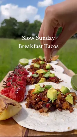 Slow Sunday mornings with @Meatless Farm breakfast tacos😍🌮🫑🌞🏕️🪵🌲 INGREDIENTS [makes 8] 8 soft taco wraps 350g meatless farm plant based mince   2 medium potatoes  2 portobello mushrooms 2 small peppers  1 medium white onion  Vegetable oil for frying  —— 2 teaspoons smoked paprika 2 teaspoons ground cumin 2 teaspoons ground garlic   Pinch of salt  —— Avocado Chilli flakes Lime  Coriander  Roasted tomatoes  METHOD 1] Prepare veg by peeling & finely grating potatoes, dicing peppers & onions, thinly slicing mushrooms 2] Add everything to a frying pan with a drizzle of oil, along with mince  3] Sautè together for 12-15 minutes until veggies begin to soften  4] Create your spice mix in a jar & shake to combine  5] Sprinkle spices over your pan mix & stir well to coat evenly, cook for further 5-8 minutes  6] Load mixture onto wraps followed by diced avocado & garnishes & a squeeze of fresh lime- enjoy!  #breakfast #veganbreakfast #tacos #veganmince #veganism #veganoptions #vegancooking #vegano #whatveganseat #breakfasttacos #nature #camping #campfire #vegancooking #vegangirl #Outdoors #naturelovers #plantbasedfoodie #plantbasedrecipes #vgang #veggie #veganfoodshare #fyp #veganfyp #sundaymornings #breakfast 