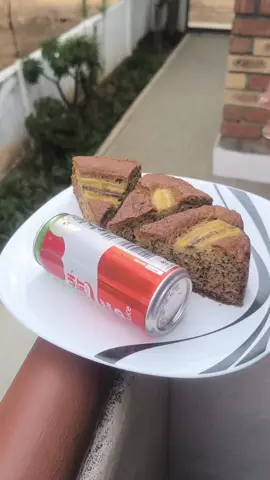 Easy banana bread recipe.  Beat 1 cup of sugar and three eggs together for about 3 to 4 minutes. Add 1 teaspoon vanilla essence  Mash 4 ripe Bananas and add to the sugar and egg mixture  Add  1/2 cup oil and 1 tablespoon butter or margarine  Add 1/4 cup milk  In a separate bowl sift 2 cups of flour, 2 teaspoon baking powder and 1 teaspoon bicarbonate of soda Add to the egg mixture  Prepare 2 baking pans or one big one Bake in preheated oven at 180 degrees for 25 to 30 minutes.