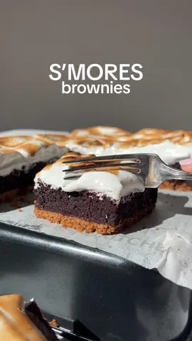 These brownies are everything you love about a classic s’more combined with a brownie. They start with a golden graham cracker crust. On top of the graham cracker crust is a fudgy chocolate brownie layer. It all gets topped with a homemade vanilla bean marshmallow topping.   Ingredients Graham Cracker Crust: 1.5 packages graham crackers ~2 cups crumbs or a half a box 1 stick salted melted butter 113 g ¼ cup granulated ugar 50 g Brownies: 1 batch of 9×13 brownies our recipe is below or even a box mix will work! Marshmallow icing: 4 egg whites 1 cup sugar 200 g ¼ teaspoon cream of tartar 1 teaspoon vanilla or 1 tablespoon vanilla bean paste #smores #smoresbrownies #brownies 