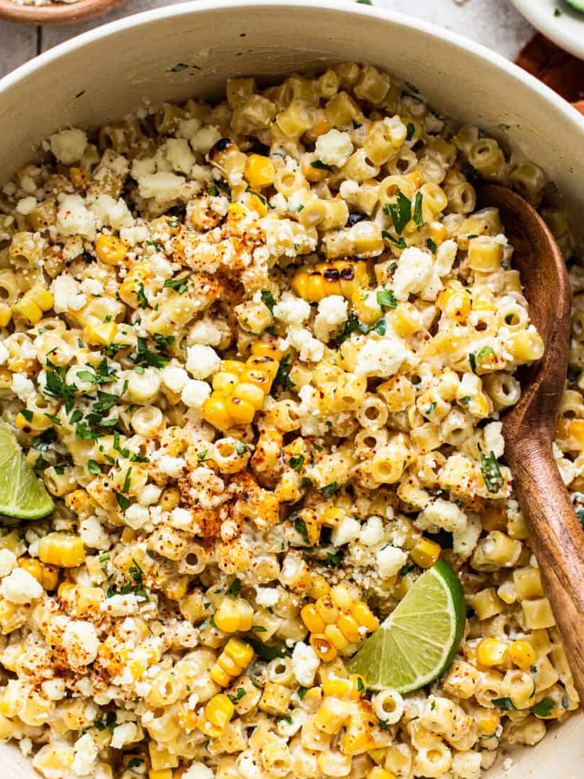 Mexican Street Corn Pasta Salad is the perfect side for picnics, potlucks, and parties! It has all the flavors of Mexican elote but in a quick and easy pasta salad.  Definelty a must make this 4th of July! Get the full recipe at the link in my @isabeleatsblog profile.  #pastasalad #sidedish #happy4thofjuly #cookoutfood