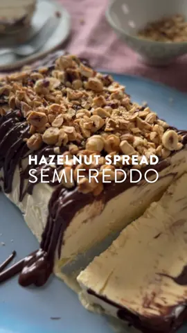 Hazelnut Spread Semifreddo | A semifreddo is a light, velvety Italian treat. Technically it’s a frozen dessert but when served, it’s more like a chilled mousse, hence the name ‘half-cold’! Drizzled with melted nutella and topped with roasted hazelnuts, this is a perfect make-ahead dinner party dessert 🍫 Serves: 6 Time: 35 minutes + freezing time 150g hazelnut spread 1 large free-range egg 3 large free-range egg yolks 1 tsp vanilla bean paste 150g caster sugar 400ml double cream 75g toasted skinless hazelnuts, finely chopped 1. Double line a 1.5 litre capacity loaf tin with cling film.  2. Put the hazelnut spread in a small heatproof bowl and then stand it in a larger bowl of boiling water for 5–10 minutes until it has softened. 3. Place the sugar, the 3 egg yolks, the 1 egg and vanilla bean paste  in a heatproof bowl and set it over a saucepan of simmering water. Using a hand-held electric whisk, beat for about 8 minutes until the mixture is thick and pale. Remove from the heat and set aside. 4. In a separate large bowl, whip the double cream until it is stiff. Fold in the pale egg mixture until combined. 5. Pour half the mix into the prepared loaf tin. Make a shallow well along the centre and pour three quarters of the melted hazelnut spread. Pour the rest of the mix over the top and, using a spoon, smooth over the surface. Cover with cling film and place in the freezer to set for 6 hours. 6. To serve, turn the semifreddo out onto a serving platter and carefully remove the clingfilm. Sprinkle it with the remaining hazelnut spread, the toasted hazelnuts and serve in generous slices.