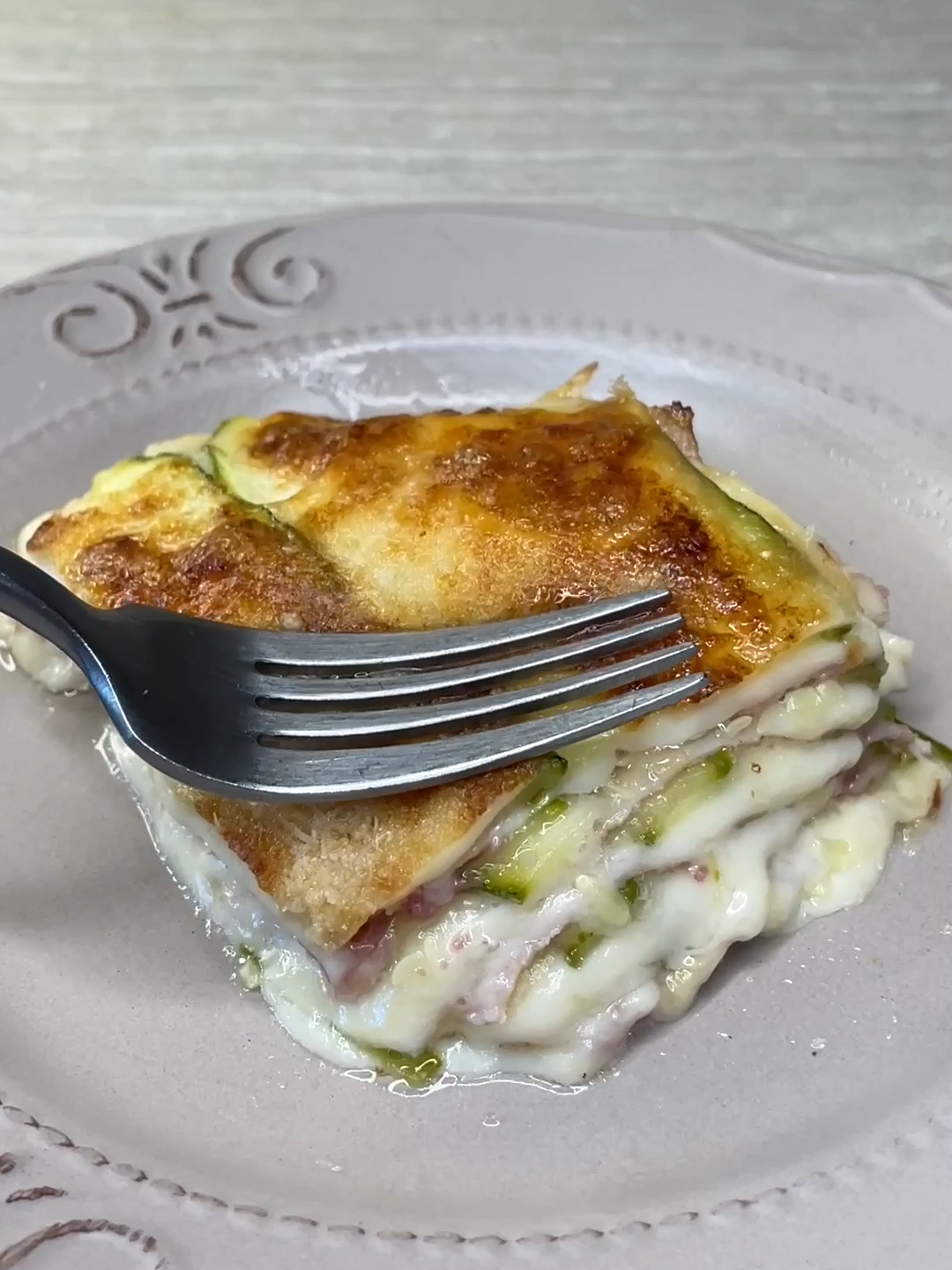 Do you love #zucchini recipes? 💚 Then don’t miss this #parmigiana! So creamy and delicious, you need to try it 🤤 Recipe by @micheleghedo ❤️ 👉INGREDIENTS 5 zucchini 200g of cooked ham 250g of scamorza or mozzarella 100g of parmesan Salt to taste. 👉METHOD 1. Wash and cut the zucchini into thin slices. 2. Arrange a first layer on a non-stick baking sheet. 3. Put cooked ham, smoked scamorza cheese and a little parmesan on top. 4. Cover with zucchini and continue until the pan is complete. 5. Sprinkle abundant Parmesan cheese on the final layer with a few slices of scamorza and bake at 180 degrees for about 30 minutes. 6. When it’s ready let it cool for a few seconds, and it’s ready to be enjoyed! Would you try it? 😋 #cookistwow #cookistrecipe #recipes #easy #quick #fun #delicious #foodtok