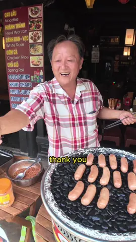 $1.18 stone-grilled Vietnamese sausage in Hoi An, Vietnam 🇻🇳 #streetfood The sausage was okay, nothing special, but the chilli powder on top was just delicious! 🌶️ Enjoyed this treat on the beautiful streets of Hoi An. Join me as I explore more unique Vietnamese street foods. #vietnamtraveling #vietnamfood #vietnamesefood #hoian #foodreviews 