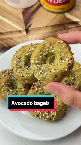 Say “YUM” if you would eat these 2-Ingredient Healthy Avocado Bagels 🥑🥯  What you need: 1 avocado 1 cup almond flour 2 tsp baking powder  Optional: Butter Everything bagel seasoning How to make them: 1. Preheat your oven to 375F. 2. Mash your avocado and set aside. 3. Mix your almond flour & baking powder. Then combine with the avocado. 4. Knead well, roll into a dough. Slice into 4-5 pieces and poke holes in the middle. 5. Brush with butter, add seasonings and bake on a greased, parchment lined sheet for 15-20 mins. Take them out & enjoy! This is a great low carb option if you’re craving a bagel that’s natural, tasty and fun to make 🙌