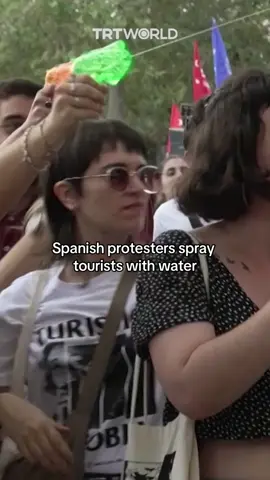 Thousands of protesters in Barcelona sprayed tourists with water in popular tourist areas on June 6.  Barcelona has seen a huge rise in housing prices in recent years, with some government officials blaming high tourist rates. Barcelona’s Mayor Jaume Collboni announced a plan in June to phase out all short-term rentals by 2028 — an unexpectedly drastic move by authorities seeking to rein in soaring housing costs and make the city liveable for its residents. #barcelona #spain #protests 