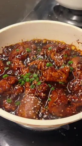 INGREDIENTS: 650-750 g chicken breasts (cut into small pieces (or you could use thighs instead) 2 tbsp soy sauce 1/2 tbsp minced ginger 1/2 tbsp minced garlic 1 tsp salt 1 tsp chili flakes (optional) 1/2 tsp white pepper For the coating: 250 g plain flour 250 g corn flour 2 tsp salt 2 tsp garlic powder 1 tsp white pepper 2 eggs 100 ml water For the sauce: 4 tbsp soy sauce 4 tbsp water 3 tbsp ketchup 2 tbsp honey 2 tbsp brown sugar 1 tbsp sesame oil 1 tbsp rice vinegar 2 tsp chili flakes Some sesame seeds, to sprinkle on top Some chopped spring onions, to sprinkle on top INSTRUCTIONS: Cut the boneless chicken thighs or breast into small pieces. In a bowl add chicken pieces, 2 tbsp soy sauce, 1/2 tbsp minced ginger, 1/2 tbsp minced garlic, 1 tsp salt, 1 tsp chili flakes (optional),1/2 tsp white pepper. Mix all this together then leave this aside whiles you make the coating. Mix all the ingredients in Frying Batter in a bowl until well combined, stir a few times to make sure there are no lumps and the batter is smooth. Add the chicken into the batter, stir to evenly coat with the batter. Heat 2 to 3 inches (5 to 7.5 cm) of the oil in a wok or a stockpot to 350°F (175°C) for deep-frying. Gently drop the chicken into the oil and loosen them up immediately with a spatula to prevent the chicken from clumping together. Deep-fry the chicken to golden brown. Remove the chicken from the oil with a strainer or slotted spoon, draining the excess oil by laying the chicken on a dish lined with paper towels. Discard the oil. Heat up 2 tablespoons of the oil in a wok or skillet over high heat. Add the garlic and stir-fry until aromatic before adding the Sauce. Soon as the Sauce thickens, add the fried chicken into the wok or skillet.  Stir continuously until all the ingredients are well coated with the sauce. Dish out, garnish with the white sesame, and serve immediately with steamed rice. #sesamechicken  #quickrecipes #fyppppppppppppppppppppppp #fypシ゚viral #viral #Foodie 