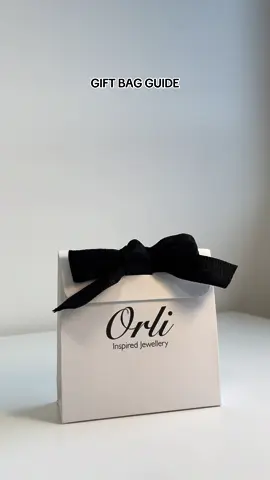 You need to watch this video🖤🤍 We flat pack our gift bags to ensure they arrive wirh you in the best condition possible! If you are unsure how to tie them correctly then watch this video!  #giftideas #jewellery #orlijewellery #jewellerygifts #jewellerypackaging 
