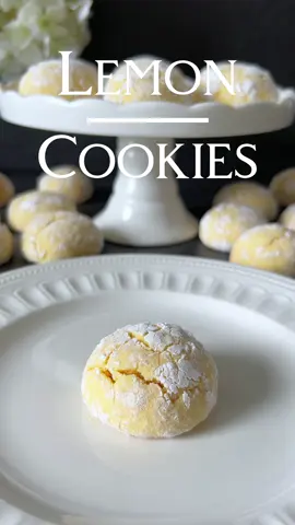 Lemon Crinkle Cookies Recipe 🤍 These Lemon Crinkle Cookies are easy to make and offer a delightfully fresh lemon flavor 😍🤍 📝 Ingredients: - 100 g sugar - 1 medium egg - 60 ml vegetable oil (Sunflower) - 1 tsp vanilla extract - Juice and zest of one large organic lemon - 250 g all-purpose flour (Type 405) - 1 tsp baking powder - 1 pinch of salt - 50 g powdered sugar (for rolling) - Optional: A few drops of yellow food coloring 🤍 Instructions: 1. Preheat your oven to 180°C (350°F) (top and bottom heat). Line a baking sheet with parchment paper. 2. In a large bowl, beat the sugar and egg with a hand mixer until frothy. Add the vegetable oil, vanilla extract, lemon juice, and lemon zest, and mix well. 3. If desired, add a few drops of yellow food coloring to achieve a bright yellow dough. 4. In a separate bowl, combine the flour, baking powder, and salt. Gradually add the dry ingredients to the wet mixture and mix until you have a smooth dough. 5. Shape the dough into walnut-sized balls. Roll the dough balls in powdered sugar until fully coated. 6. Place the dough balls on the prepared baking sheet, spacing them adequately. Bake the cookies in the preheated oven for about 10-12 minutes, until they are lightly golden and the surface has cracked. 7. Remove the cookies from the oven and let them cool on the baking sheet for a few minutes, then transfer to a wire rack to cool completely. Enjoy these delicious Lemon Crinkle Cookies, perfect with a cup of tea or coffee! 🤍