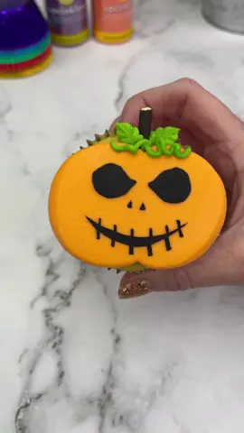 SUMMERWEEN 🎃🎃🎃 What are your thoughts on this?  #summerween is it too early to start making some Halloween content for you? Or do you like to see it early enough that you can be prepared? 🎃👻🎃 🎃 Add two large buttercream dots onto a cupcake. 🎃 Press down onto parchment paper. 🎃 Freeze for 15 minutes 🎃I used a sharp knife to cut out a face on parchment paper. 🎃 Stick the parchment stencil on top.  🎃 Spread black buttercream over the stencil. 🎃 Remove the parchment paper. 🎃 Add a pocky for the stem and use tip 352 for some leaves.  #cupcake #summerween #cakedecorating #cutebaking #pumpkin #cakedbyrach  #caketok 