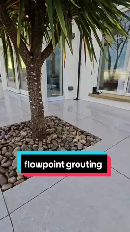 flowpoint grouting 💪#fyp #foryou #howto #flowpoint #grouting #grout #porcelain #landscaping #construction 