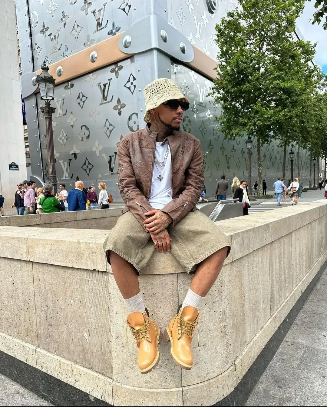 Macc Gee chilling outside in Paris France. |💚