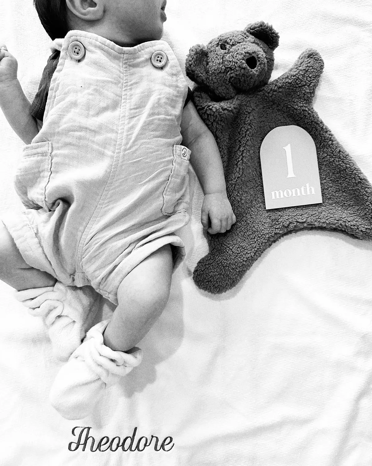 This little boy is so incredibly sweet, he loves snuggling up for a contact nap and has the cutest raspy coos. He’s got a strong cowlick just like daddy, and dimples when he smiles like his mom.  He isn’t a fan of his bassinet or tummy time, but is doing so well keeping his head up and is so strong. He loves watching his sister play and is mesmerized by his puppy dog.  He is the most perfect little boy and has completed our family of four ( 5 including Kona of course). He’s grown our hearts more than we could’ve imagined , and somehow continues to more and more each day. 🤍 #baby #newborn #update #onemonthold #parents #parenthood #babyboy #milestone #demiandtom 