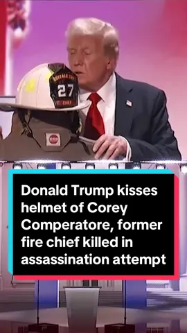 Donald Trump walks over and kisses the helmet of former fire chief Corey Comperatore, who was killed in the attempted assassination of Trump at the Pennsylvania rally over the weekend. 