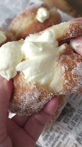 Homemade Japanese Nama Donuts (生ドーナツ) | Soft and Creamy! This donut draws inspiration from the beloved Japanese Nama donuts（生ドーナツ）. Their round shape is covered with sugar on the surface, while others are generously filled with a variety of flavoured creams. The texture is incredibly delicate, seemingly melting away with each bite. I’ve crafted these donuts to be reminiscent of the soft, fluffy, and delightfully chewy Japanesed Nama Donuts, ensuring satisfaction with every heavenly bite. Recipe Milk 110ml(If it is a warm day, then just use room temperature milk. Otherwise, if it's a cold day, you should use warm milk around 30-35°C) Beaten Egg 30g Instant Yeast 3g Caster Sugar 20g Bread Flour 200g Salt 3g Unsalted Butter 30g For the filling: Whipping Cream 250ml Caster Sugar 25g Cream Cheese 125g ・Oil temperature is 170°C ・Fry each side 1.5 - 2 mins or until both sides are golden brown. Full video in my Youtobe channel: https://youtu.be/DstSosVd7Ls?si=tLiMzHLKyNZEbf1d #生ドーナツ  #ドーナツレシピ  #donuts  #homebaking  #breadrecipe 