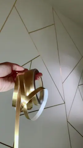 Revamp your space effortlessly with this 50 meters self-adhesive gap tape! 🏠✨ Perfect for walls, floors, and ceramic tiles. Mildewproof and decorative, say goodbye to gaps and hello to a polished look! #homeimprovement #diydecor #goldtape #roomdecor #homedecor #fypシ #fypシ゚viral #fyp 