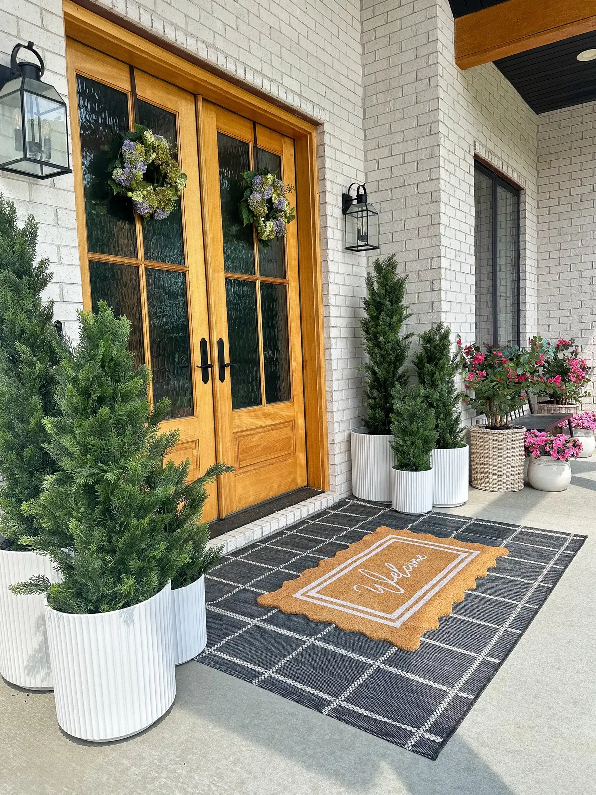 Yesterday I worked on a front porch refresh and the entire look is from @walmart! I think this is my favorite look I have done so far and it’s the most affordable! Let me know in the comment section if you would like the links to any items shown! #frontporch #greenery #fauxplants #frontporchdecor #walmart #walmartclearance #walmartfinds #walmartdeals #nearlynatural #veradek