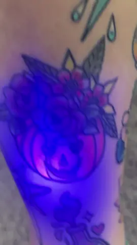 I finally bought a little UV light and got to see my tattoos glow up! #tattoo #uvtattoo #tattootiktok #halloweentattoo 