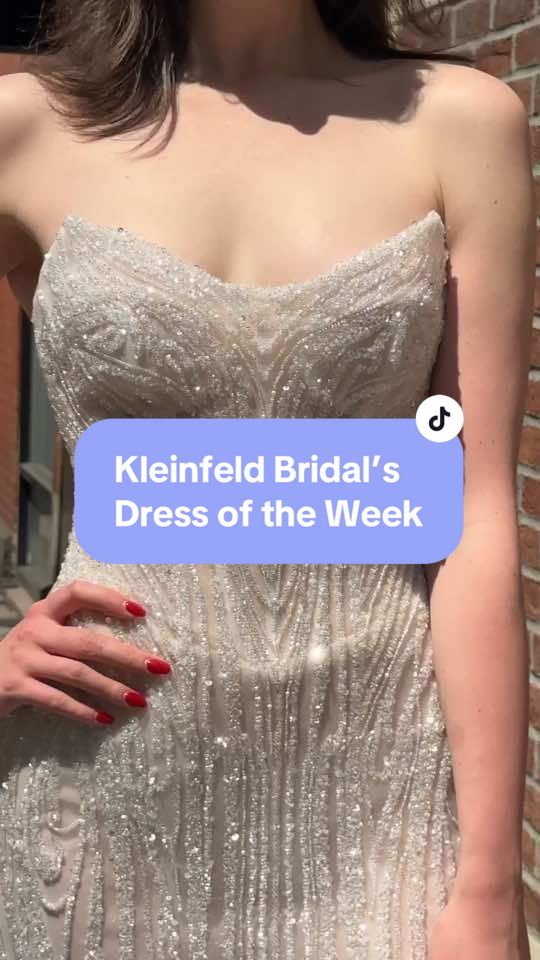 Calling all #KleinfeldBrides! We’re thrilled to share some of the stunning new arrivals at our #NYCBridalSalon each week! This week's pick is the breathtaking @Netta BenShabu #CarlaGown. We adore the contemporary cat-eye neckline and strapless sweetheart cut that enhances its structured corset bodice, celebrating every curve. With linear beading that catches every light, this gown is a perfect blend of elegance and glamour. Stay tuned for next week’s favorite, and let us know which wedding dresses you’ve been eyeing—comment below!✨ #kleinfeld #kleinfeldbridal #kleinfeldexperience #kleinfeldbridalsdressoftheweek #nettabenshabu #straplessweddingdress #beadedweddingdress