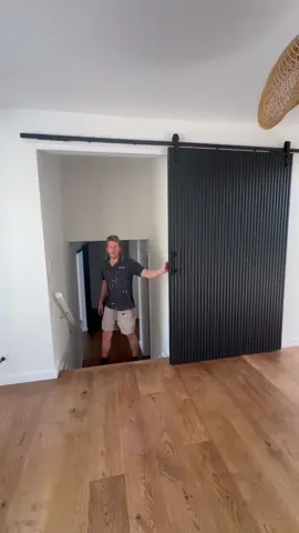 Looking for a stylish way to close off your stairs?  Check out this stunning barn door installation! Not only does it add a touch of style to your home, but it also provides a practical solution for privacy and safety.  Transform your space with a custom barn door that perfectly fits your style and needs.  #BarnDoor #Stairs #BrisbaneBarnDoors #CustomMade 