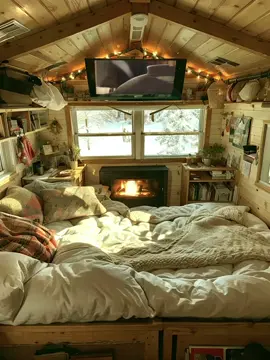 Escape into a cozy cave bedroom with the perfect winter vibes! 📚❄️ Curl up with your favorite books, enjoy cartoons on screen, and watch the heavy snowfall through the window. Perfect for those who love serene and snug spaces. #CozyBedroom #WinterVibes #CartoonTime #Snowfall #SereneScapes