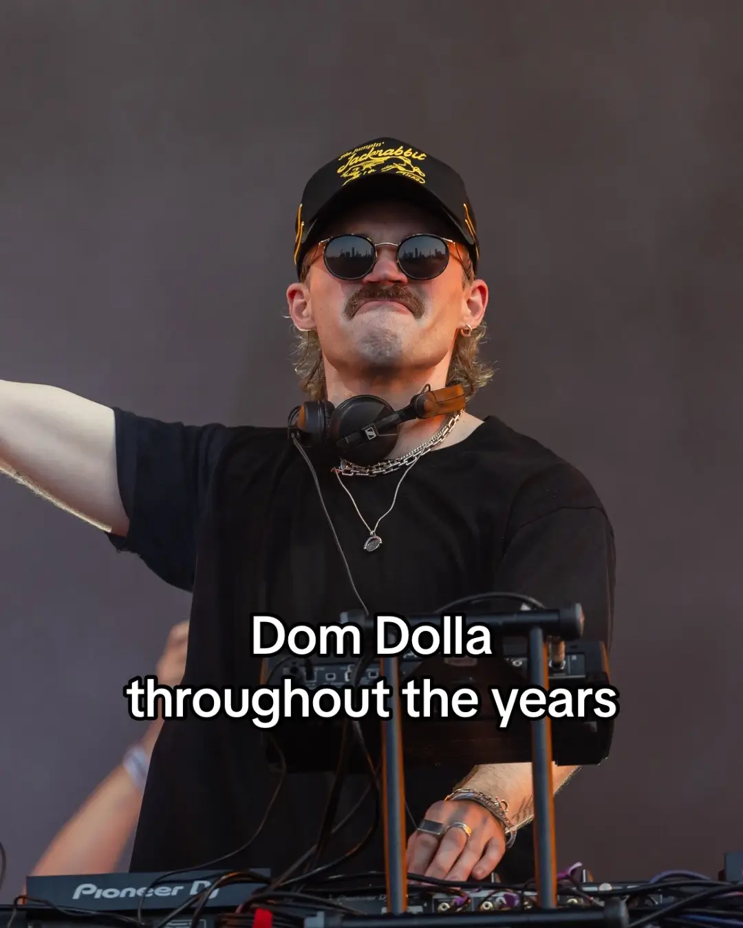 The iconic moustache stays an ever-constant for @Dom Dolla 🫡 #domdolla #throughouttheyears #housemusic #techhouse #ravetok #moustache 