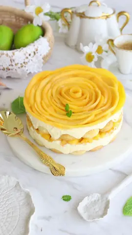 Eggless Mango Tiramisu  Ingredients: •3 medium mangoes, thinly sliced •250g mascarpone cheese •300ml heavy cream •4 tbsp sugar •250g Ladyfingers biscuits •1 tsp vanilla extract  •1 cup mango nectar or orange juice Method: 1. Line a round cake ring 2. Whisk cream until thickened, then add sugar and vanilla extract. 3. Add mascarpone cheese and whisk until combined. 4. Dip biscuits in mango nectar and arrange in the pan. 5. Spread half of the cream-cheese mixture over the biscuits. 6. Top with mango slices. 7. Repeat layers: biscuits dipped in nectar, cream-cheese mixture, and mango slices. 8. Refrigerate overnight. 9. Remove the pan sides and serve chilled mangomisu. #mango #tiramisu #mango #mangodessert 