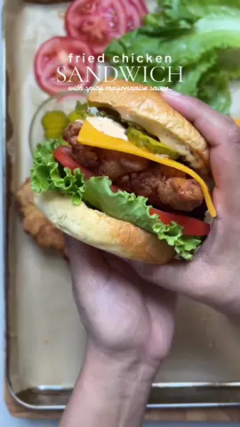 Crispy fried chicken sandwich 🍔 For the Chicken: - 2 lb boneless chicken thighs - 2 cups buttermilk - 1/3 cup pickle juice - Salt to taste - 1 tsp black pepper - 1 tsp red chili powder - 1 tsp garlic powder - 1 tsp onion powder - 1 egg For the Dry Batter: - 2 cups all-purpose flour - Salt to taste - 1 tsp black pepper - 1 tsp red chili powder - 1 tsp garlic powder - 1 tsp onion powder For the Burger Toppings: - 8-9 brioche buns - Pickled cucumbers - Tomatoes, sliced (8-9) - Cheddar cheese slices (8-9) - Lettuce For the Spicy Mayonnaise Sauce: - 1 cup mayonnaise - 1 tbsp Dijon mustard - 1 tbsp hot sauce - Salt to taste - 1/2 tsp black pepper - 1 tsp garlic powder - 1 tsp dried parsley Method Step 1: Marinate the Chicken - In a large bowl, whisk together buttermilk, egg, pickle juice, salt, black pepper, red chili powder, garlic powder, and onion powder. - Add the chicken thighs and marinate for at least 2 hours or overnight. Step 2: Prepare the Dry Batter - In a separate bowl, whisk together flour, salt, black pepper, red chili powder, garlic powder, and onion powder. Step 3: Dredge the Chicken - Remove the chicken from the marinade, allowing excess to drip off. - Dip each piece in the flour mixture, shaking off excess. - Dip in the buttermilk batter again, making sure to coat completely. - Dredge in the flour mixture again, pressing gently to adhere. Step 4: Fry the Chicken - Heat about 1/2-inch of oil in a large skillet over medium-high heat. - Fry the chicken for 5-6 minutes per side, or until golden brown and crispy. - Drain on paper towels. Step 5: Assemble the Sandwich - Toast the brioche buns. - Spread spicy mayonnaise sauce on the bottom bun. - Add a fried chicken thigh. - Top with pickled cucumbers, tomato slices, cheddar cheese, and lettuce. - Top with the top bun. Spicy Mayonnaise Sauce - Whisk together mayonnaise, Dijon mustard, hot sauce, salt, black pepper, garlic powder, and dried parsley. #crispychicken #chickensandwich #sandwich #Recipe #spicychicken 