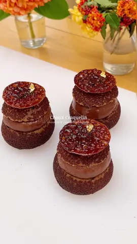 Chocolate and caramelized banana choux with crispy cocoa craquelin, creamy milk chocolate filling & delicate chocolate tuile🍌🤎 It’s a chocolate lover’s dream✨ Full recipe’s up on my Instagram subscription feed.  #chocolate #choux #banana #dessert #pastry #bake 