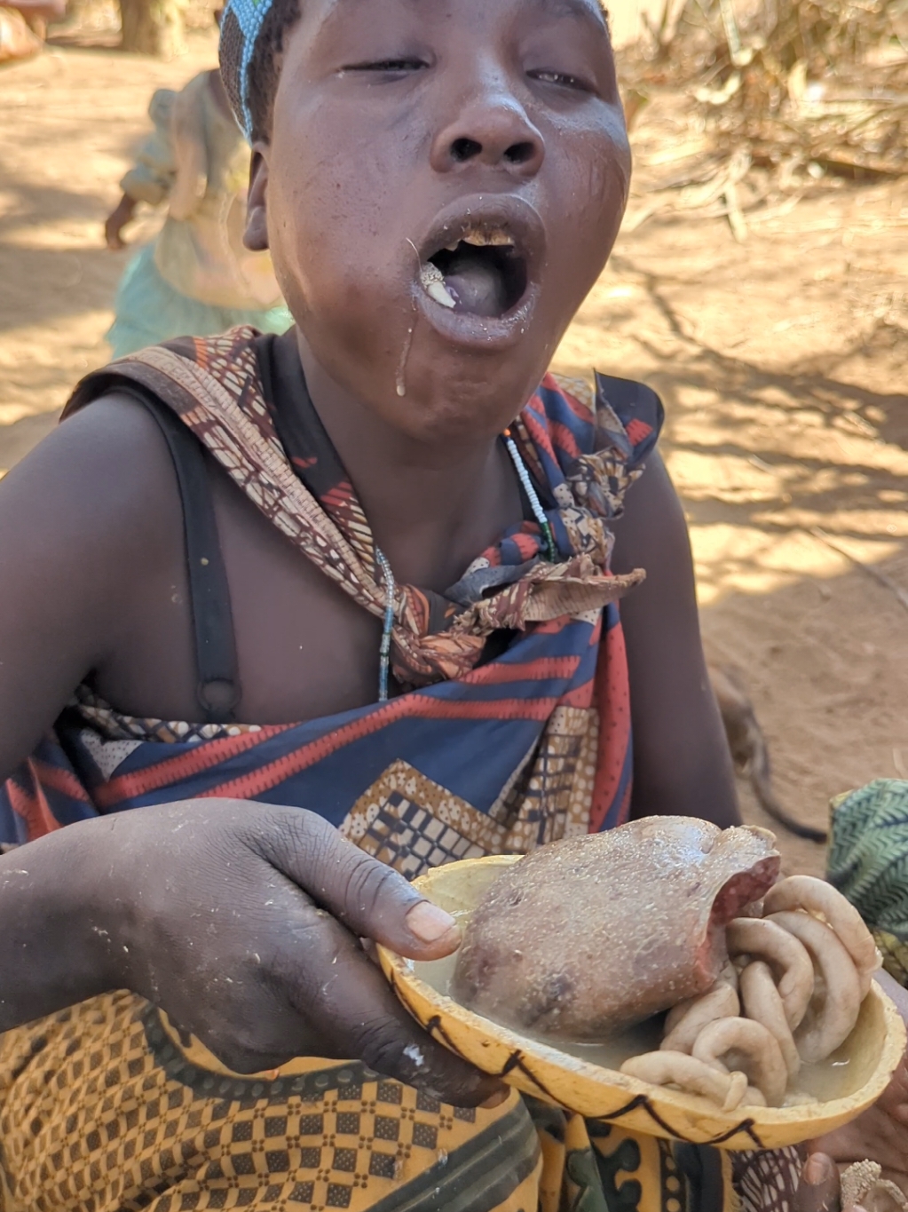 It's Enjoy 🥰 Lovely food Girls hadzabe tribe eating their lunch time.