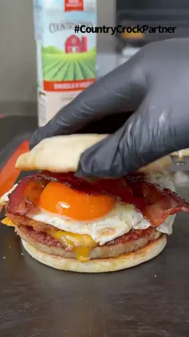 Country Breakfast Sandwiches using the new Country Crock Drizzle and Sizzle #CountryCrockPartner 🔥 . I used the new @Country Crock Drizzle and Sizzle for every step of the process for these breakfast sandwiches. It’s great because it gave me the ability to cook on the griddle, spread on my buns for an awesome toast and even cooking my eggs. This guaranteed me to add an extra delicious buttery flavor throughout the whole cook 🤤 . #ad #countrybreakfast #sizzle # food