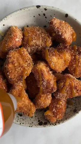 AIR FRYER HOT HONEY SALMON BITES Ingredients: 1 lb salmon, skin removed, diced into cubes 2 eggs 1 cup panko breadcrumbs 1 tsp garlic powder 1 tsp onion powder 1 tsp paprika 1/2 tsp salt Olive oil cooking spray 1 tbsp hot honey 1 tsp sriracha  For serving: I like to have this with avocado and seaweed, or in with rice and broccoli! Instructions  1 Whisk together eggs in small bowl. In a separate bowl add bread crumbs, garlic powder, onion powder, paprika, and salt. Mix. 2. Add salmon to egg mixture then breadcrumbs and spray with olive oil cooking spray.  3. Add to air fryer basket or tray in an even layer and air fry at 400 F for 6-8 minutes. Transfer to a bowl then drizzle with hot honey and sriracha. ENJOY! #salmonrecipe #airfryerrecipes #healthyrecipes 