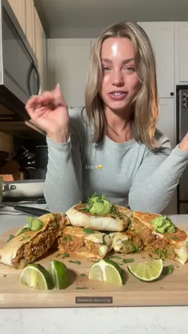 Healthy burrito thats high protein 🌯✨🥑 recipe below!! Ingredients: @Poppi for tbe good vibes 1 lb ground turkey 1 packet @Siete Foods spicy taco seasoning 1 yellow onion, diced @lundbergfarms spanish rice @Good Culture cottage cheese Mexican cheese Burrito sized tortillas Shredded lettuce  2 avocados  1 garlic clove Juice of 1 lime (more for topping) Cilantro Seasonings: Cumin, salt, pepper Instructions: 1. Brown onions and turkey, then add in taco seasoning 2. Cook rice as directed 3. In a bowl, combine taco meat, rice, shredded cheese and a few tbsp cottage cheese 4. In a blender, combine avocados, garlic, juice of 1 lime, a few tbsp cottage cheese, and a little water and blend until smooth 5. Lauer burrito starting with cheese, then burrito filling, then  guacamole, then cheese 6. Brown on both sides on pan (@Caraway Home ELLIETEALE10 for 10% off😚) or airfry  7. Top with cilantro, lime juice and additional guacamole 8. Enjoy 😚 #healthydinner #healthydinnerideas #healthymeals #healthyrecipes #EasyRecipe #highprotein #burrito #tacobell #crunchwrap #poppipartner #sodasback 