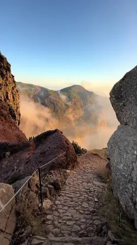 The PR1 trail from Pico do Arieiro (1818 m) to Pico Ruivo (1862 m) is the most famous hike on Madeira Island. This  path connects the 3rd highest peak with the highest peak on the island, offering countless viewpoints of the colorful valley and rocks above the clouds. You go from peak to peak, which is why it’s also commonly known as the “Pico to Pico” hike. It is an adrenaline-filled test of endurance with steep inclines, causing some serious quad and calf burning on the trek. If you are up for the challenge, this will be the highlight of your trip to Madeira. 📍Location: Pico do Arieiro - Pico Ruivo hike (PR1), Madeira, Portugal 🇵🇹 Bookmark and share with friends for your future Madeira trip 💫 💡Discover more incredible places and helpful travel tips in my Interactive Guide with a Map of Madeira 🗺️ 👉🏼 Link in bio 🔗 #MadeiraIsland #PicoDoArieiro #PicoRuivo #HikingAdventure #TrailLife #MountainViews #PR1 #SunsetHike #VisitMadeira #ExploreMadeira #HikingTrip #HikingisLife #GoOutdoors #PeakToPeak  