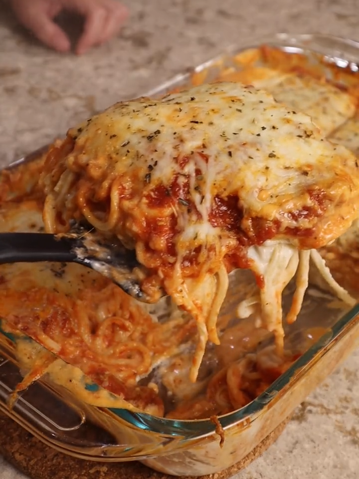 Cheesy Baked Spaghetti You will need: 1 box of spaghetti $0.99 8 ounces of cream cheese $1.99 6 ounces shredded parmesan $2.00 8 ounces shredded mozzarella $2.00 24 ounces pasta sauce (I used Prego italian sausage & garlic) $3.29 Margarine or butter / flour / milk / garlic powder  $1.25 each at Dollar Tree If you already have the pantry ingredients that makes the cost $10.27 for 8 large servings or total cost $15.27 if you had to buy everything I started off by making a parmesan sauce for my pasta, to a skillet i added 2 tablespoons of butter and once that had fully melted I whisked in 2 tablespoons of flour.  I let that cook for a minute or two before adding in 2 cups of milk and 8 ounces of cream cheese which I cut into cubes so it would melt easier.   Once the cream cheese was melted, I whisked in  some salt, pepper, garlic powder, and  6 ounces of shredded parmesan cheese.   This sauce was looking a little thick so I also added some extra milk to get it to a thinner consistency. I boiled 1 lb of spaghetti, to my liking which is a little more than al dente. And then into a 9 x 13 baking dish I mixed my spaghetti with my parmesan cheese  sauce.  Making sure that all of the noodles were well coated in the sauce. Then goes on a layer of my favorite pasta sauce, which if you’ve been here for a minute you know that is prego italian sausage and garlic sauce, which already has meat in the sauce.  I love this because it saves me from having to buy meat or dirty an extra pan. Lastly goes 8 ounces of shredded mozzarella cheese and then bake this at 400 degrees for 20 minutes. Let cool slightly before cutitng and serving and enjoy! #spaghetti #bakedspaghetti #cheesyspaghetti #kidfriendlydinner #familydinnerideas #cheapdinnerideas #whattomakefordinner