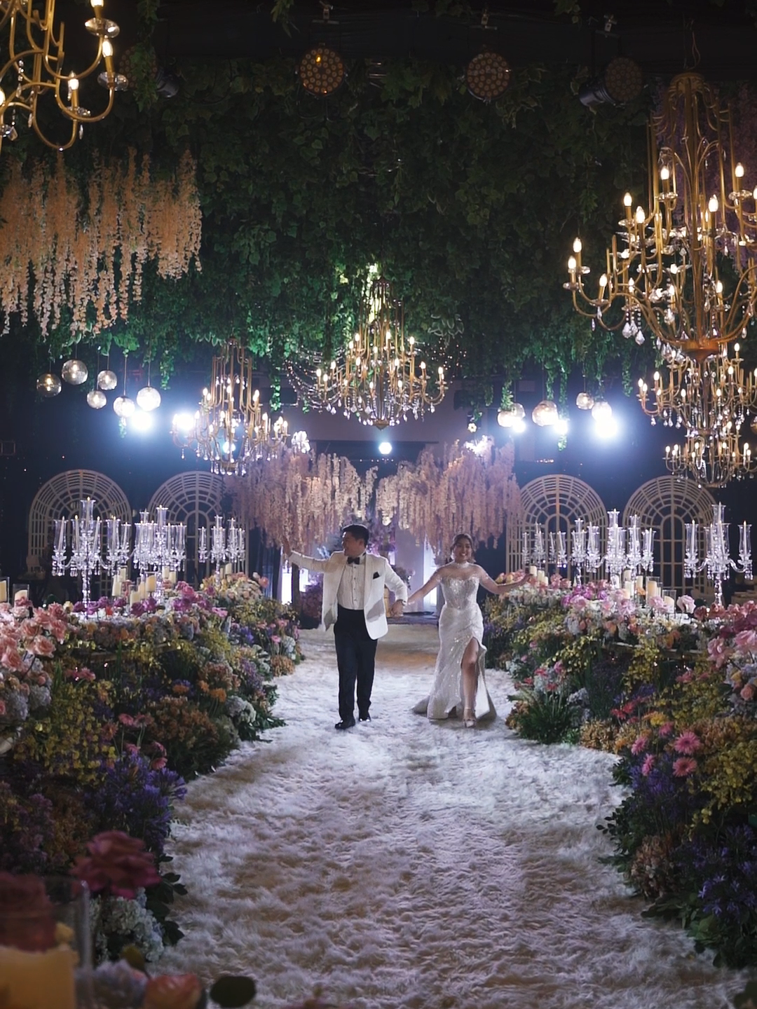 Transforming this venue into an enchanted forest was a journey of magic and meticulous planning. To create a fairytale atmosphere, we curated beautiful golden arches and lush greens with vibrant blooms. Every detail, from the floral arrangements to the atmospheric lighting, was designed to immerse guests in a truly magical experience. Book our event styling services to make your special occasions just as magical and memorable. Let us bring your vision to life with creativity and flair! #EnchantedWedding #EventStyling #BehindtheScenes #StyledbyJacqs #eventstylistlife #royalwedding #luxewedding #luxurywedding #weddingeventstylist #weddingtrends #weddingtrends2024 #weddingtransformation #WeddingTrends #WeddingsPh #floralbloom #eventstylingph