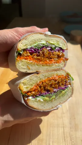 VEGAN TOFU CHIK’N SAMMIE🔥  Last week I posted a recipe for vegan tofu chik’n and y’all loved it! Here’s a simple yet very delicious sammie that packs in tons of fresh veg and full-on flavors. This tofu chik’n is so versatile. Excited to bring y’all more fun recipes with it! ingredients  1 block super firm tofu (or pressed extra firm) 6 tbsp olive oil 1/2 tsp salt black pepper to taste 1 tbsp smoked paprika toasted french bread slices vegan mayo shredded red cabbage julienned carrots cilantro leaves pickled jalapeño thin sliced avocado prep preheat your oven to 450F. shred your block of tofu with a cheese grater. add to a parchment lined baking tray along with olive oil, salt, pepper, and smoked paprika. mix together and level the tofu shreds out into one large sheet. bake for 30 mins. remove from the oven and allow to cool 10 mins. roll up the tofu sheet and thinly slice across into fine pieces. serve on french bread with all the fixing and enjoy my friends 🙏🏼 #veganrecipes #vegansandwiches #tofurecipes