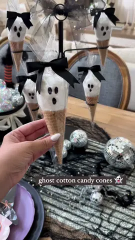 👻✨ Ghost Cotton Candy Cones: Spooky Sweet Treats for Halloween!  Get ready to add a hauntingly sweet touch to your kids Halloween party with these Ghost Cotton Candy Cones! 👻✨ I used fluffy white cotton candy and drew ghost faces on clear plastic bags to create these adorable ghostly treats. When the black marker faces are up against the cotton candy, they look like little ghosts! Using my favorite handy drink tower, I displayed the cones for a fun and festive setup. Perfect for a kids’ Halloween party or a spooky sweet treat station! be sure to SAVE for inspo and SHARE with your Halloween loving bestie!  ✨ **Hosting Tip:** Let your little ghouls and goblins decorate their own ghost cones for an interactive and delicious Halloween activity. It’s a hit for all ages! #halloween #halloweendiy #halloweenparty #halloweensweets #halloweenkidsparty #halloweenkids #halloweenfood #halloweeninspo #halloweenideas #spookysnacks #hostingideas #halloweenhome #spookyszn  Halloween, ghost cottony candy cones, Halloween sweat treat, Halloween kids party, Halloween diy, Halloween hosting, Halloween party, spooky snacks, spooky season, Halloween home