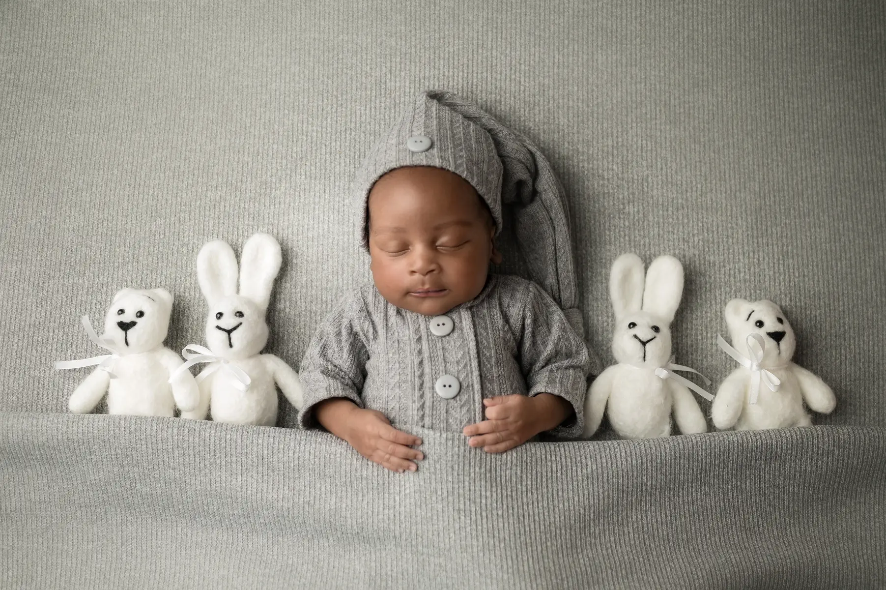 Newborn shoots are beat done before baby turns 14 days, capture them while they are still small. 