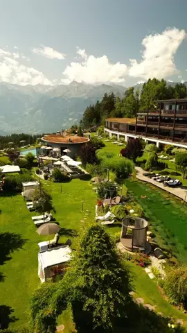 View from above. Enjoy our mythic garden in summer! #hotelchaletmirabell #thespiritofmeran #wellnesshotel #dolomites #poolside #lakeside #luxuryholiday #mountainview #beautifuldestinations #visitsouthtyrol #summerlover 