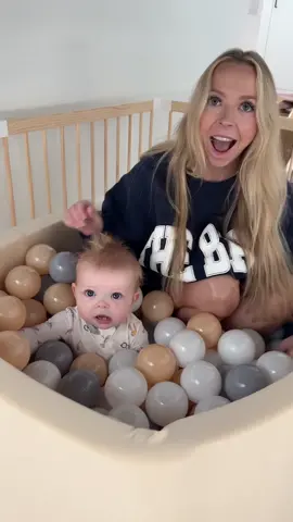 Ellie looked so happy at the end 🥹❤️ backstory ::: Kay has been working on this space for Ellie under the stairs. It’s going to be a place that she can play while kay is cooking or doing other things! It has a fence and padded floor and now a ball pit! 😂 Kay’s idea is that when Ellie gets old enough to walk around, she will sometimes need to be put in there so kay can focus on other tasks around the house! Ellie and I walked up to Kay adding the balls to the ball pit, and she was so excited! Kay immediately got in the fence and we let Ellie try playing in the ball pit. She seemed to like it! I think she was a little shocked at first with how many balls there were to play with, but eventually she learned how to push them around and play! I think that will be so fun for her to play! The walls and bottom are soft, so it seems like a perfect toy for her to use and not bump her head or anything! I am excited to see what else kay adds to Ellie’s little play area under the stairs! ❤️ #kayandtayofficial #couples #relationships #pregnant #postpartum 